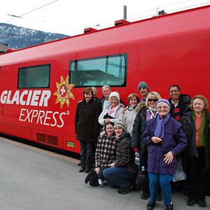 Tour group enjoying the Glacier Express on the Swiss Mountain Rails Tour