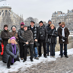 Tour group enjoying a Winter scene in front of Nortre Dame